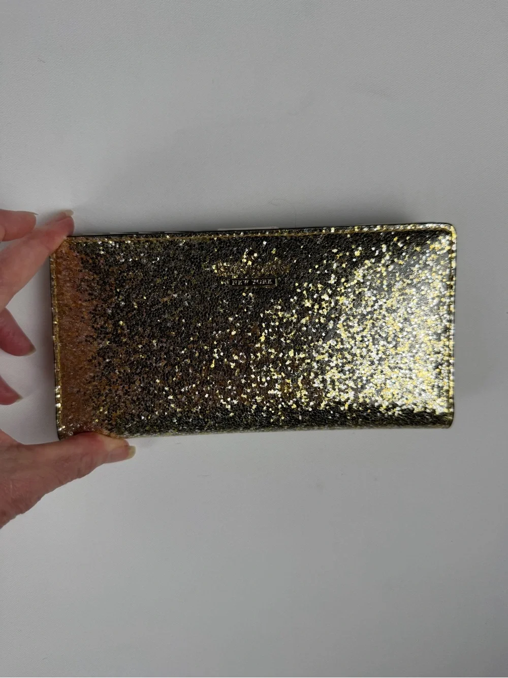 kate spade Gold Glitter Folio wallet with magnetic closure - fun and flirty
